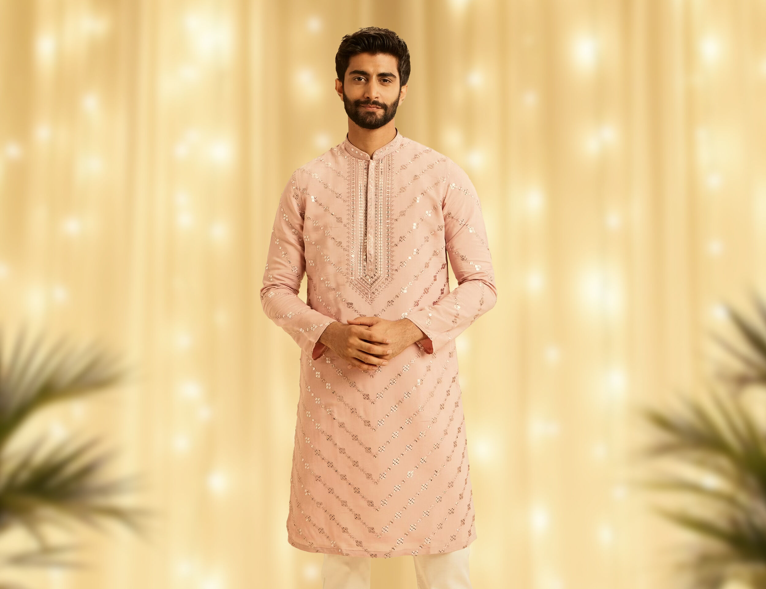 Man wearing a festive peach kurta with geometric sequin work and a detailed placket